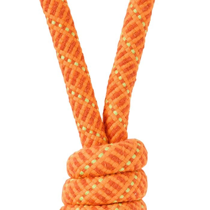Close-up of an orange rope with a knot on a white background