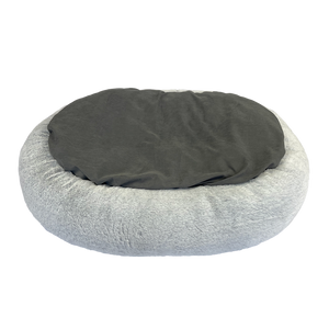 Round pet bed with gray cushion on a white background