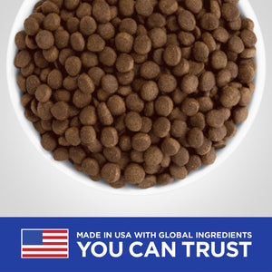 Bowl of brown pet food with 'Made in USA with Global Ingredients You Can Trust' text at the bottom.