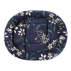 Floral-patterned pet bed with a navy blue background at Pet Servo