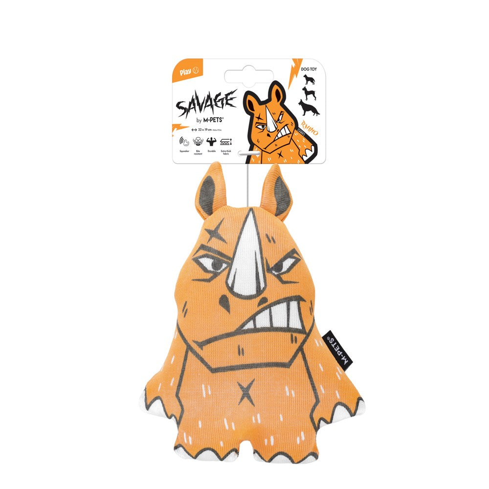 An orange rhinoceros-shaped dog toy with a white horn and black stitched details, hanging from its original retail card packaging on a plain white background at Pet Servo