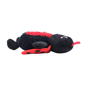 A plush insect toy, resembling a ladybug, with a black textured body, red fuzzy back, red wings, and a small pink face, shown on a plain white background.