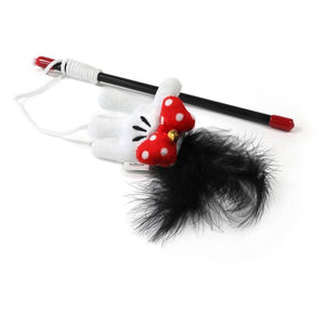 Cat toy with a black feather on a white background