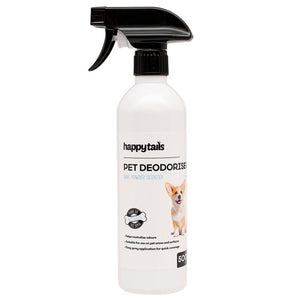 A 500ml white plastic spray bottle of Happy Tails Pet Deodorise spray with a black trigger sprayer, featuring a label with a small Chihuahua dog illustration.