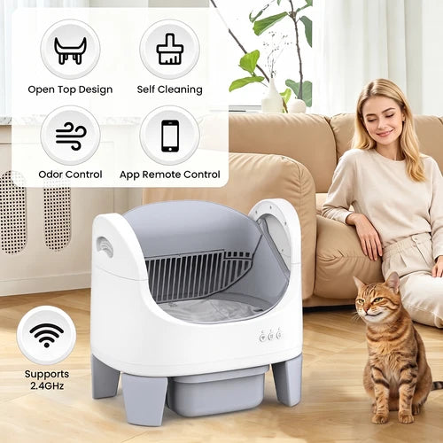 A white and gray automatic pet litter box shown in a living room setting with a woman sitting on a couch and a tabby cat standing nearby. The image includes feature callout graphics in the top left and bottom left, highlighting open top design, self-cleaning, odor control, app remote control, and 2 at Pet Servo