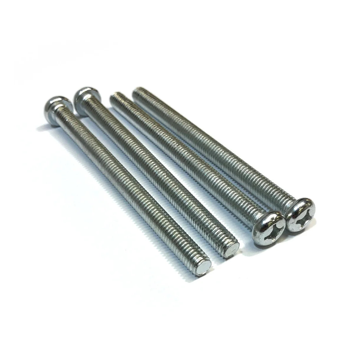 Four metal screws on a white background
