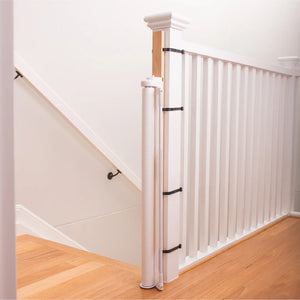 Staircase with white balusters and wooden handrails in a home setting.