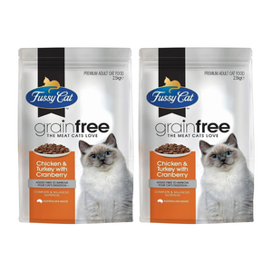 Two packages of Fussy Cat grain-free cat food on a white background