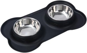 A black silicone pet feeder and water bowl holder with two stainless steel bowls, shown on a plain white background at Pet Servo