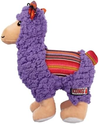 A purple plush llama dog toy with a textured sherpa-like body, tan face and legs, and a red, orange, yellow, and black striped saddle, shown on a white background. A KONG brand tag is visible on its side at Pet Servo