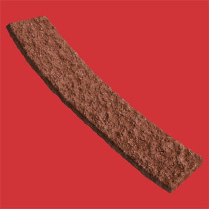 A textured rectangular brown stone or concrete sample shown diagonally on a solid red background.