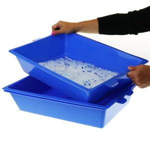 Blue plastic litter box with a person interacting with it on a white background at Pet Servo