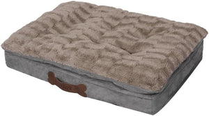 Dog bed with textured surface and bone-shaped handle on a white background at Pet Servo