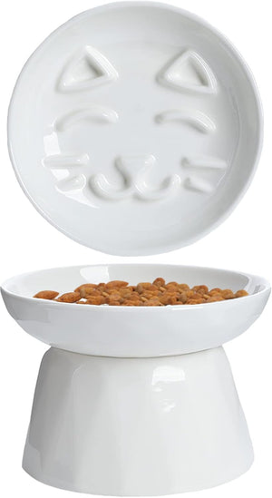 White elevated pet feeder with a cat face design, filled with food at Pet Servo