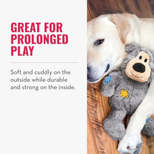 Dog playing with a plush toy on a wooden floor, with text about the toy's durability and play value at Pet Servo
