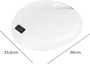 A white oval-shaped electronic device with a small black control panel, shown with dimension lines and labels indicating 33.5cm width, 36cm depth, and a height of 10cm on a white background at Pet Servo