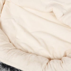 Close-up of a beige blanket with soft texture at Pet Servo