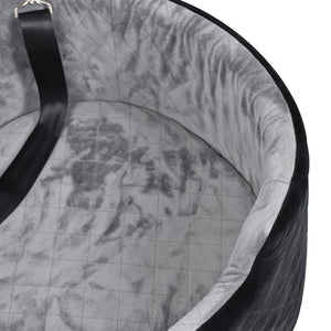 Close-up of a gray quilted bag with a black strap on a white background at Pet Servo