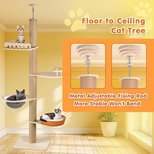 A tall floor-to-ceiling cat tree in a beige wood-look finish with multiple platforms, a hanging hammock, and a perch, shown in a yellow room. Two cats are resting on the tree at Pet Servo