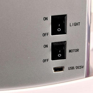 Control panel with switches and ports on a light gray background at Pet Servo