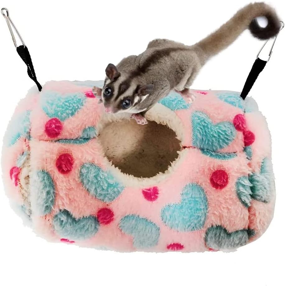 Small animal on a plush pink and blue toy with a white background at Pet Servo
