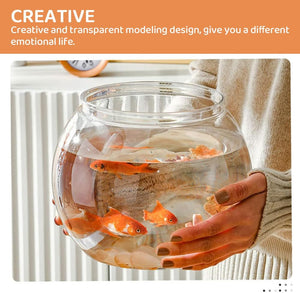 Hand holding a glass fishbowl with goldfish, with text about creative design at Pet Servo