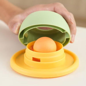 Stackable silicone egg holder with a hand lifting one of the stacked holders to reveal an egg at Pet Servo