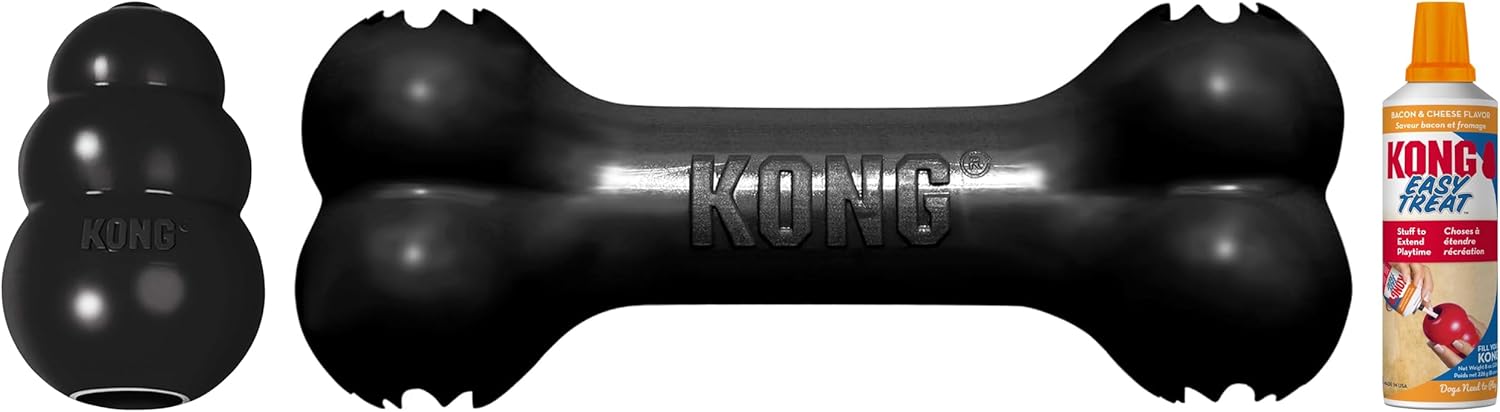 Kong dog toy set featuring a black rubber bone-shaped dog toy in the center, a black rubber Kong Kube toy on the left, and a bottle of Kong Kube treat dispenser on the right, all on a white background at Pet Servo