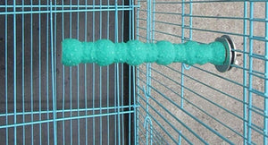 Green cylindrical object attached to a metal cage at Pet Servo