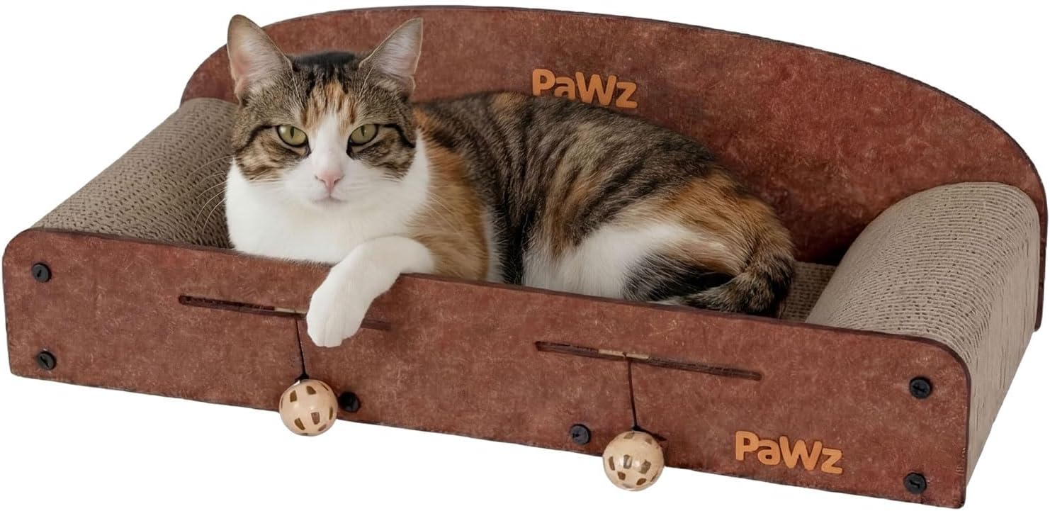 A calico cat rests inside a Pawz brand cat bed with a brown faux-leather exterior, a beige textured inner cushion, and small hanging wooden toy balls on the front at Pet Servo