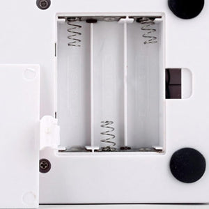 Close-up of a mechanical device with springs and a white background at Pet Servo