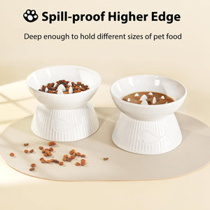 Two white pet bowls with elevated bases on a beige surface, containing pet food at Pet Servo