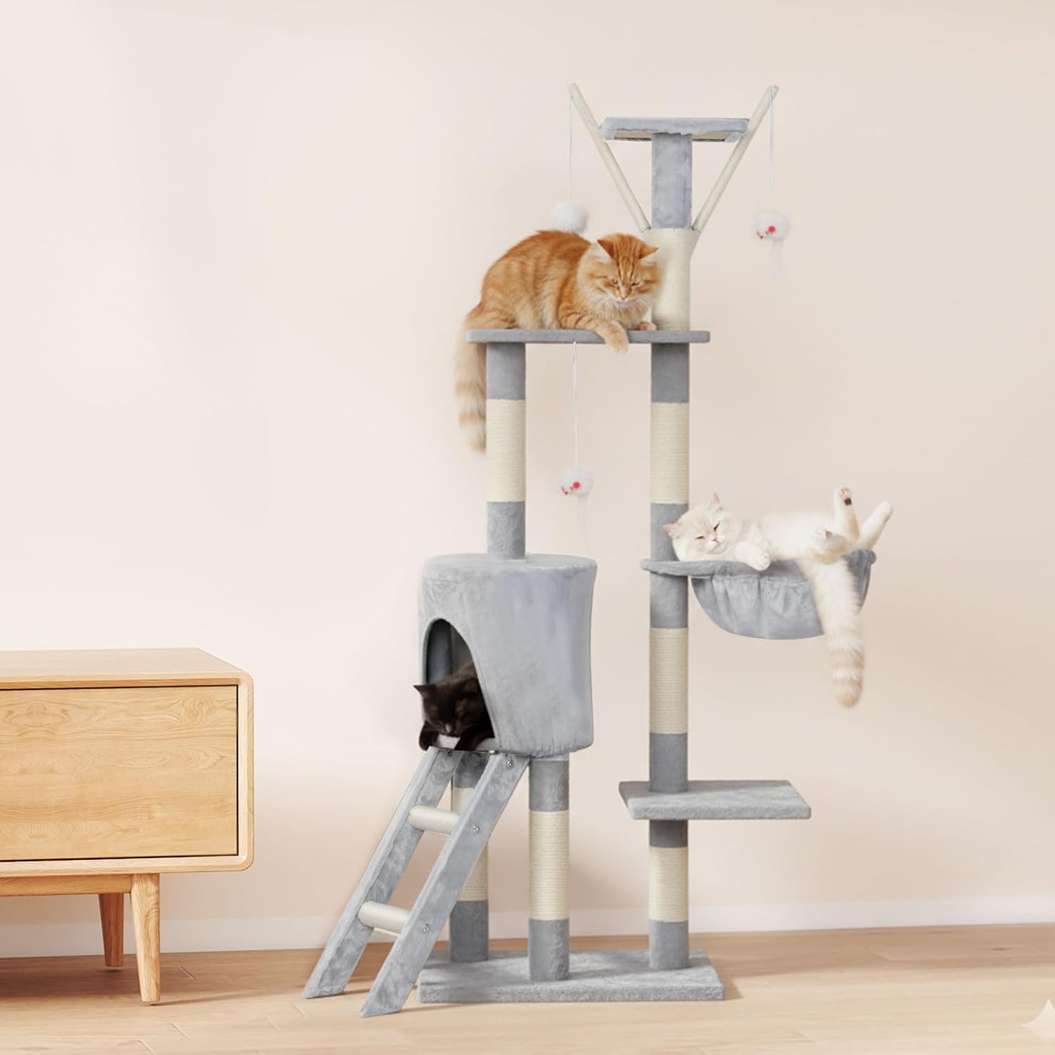 Cat tree with multiple levels and cats on a light-colored floor at Pet Servo