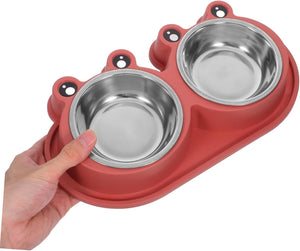 A red silicone pet feeding tray with two stainless steel bowls, held by a human hand against a plain white background at Pet Servo
