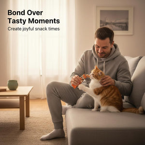 Man sitting on a couch with an orange cat, holding a treat, in a cozy living room at Pet Servo