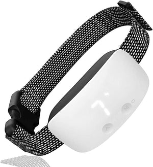 Black and white dog collar with a reflective strip on a white background at Pet Servo
