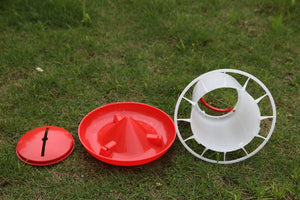Red and white plastic items on grass at Pet Servo