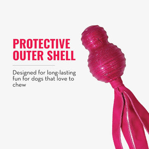 A bright pink dog toy with a textured, bumpy outer shell and long ribbon tails, shown next to text that reads 'PROTECTIVE OUTER SHELL' and 'Designed for long-lasting fun for dogs that love to chew' on a light gray background at Pet Servo