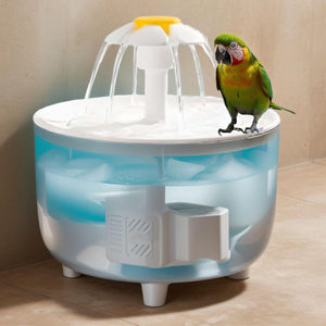 Bird perched on a pet water fountain with a beige background at Pet Servo