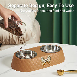 Pet feeding station with two bowls and a decorative bow, being filled with food at Pet Servo