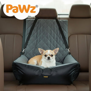 Dog sitting in a gray and black car seat cover with 'PaWz' branding on a car seat at Pet Servo