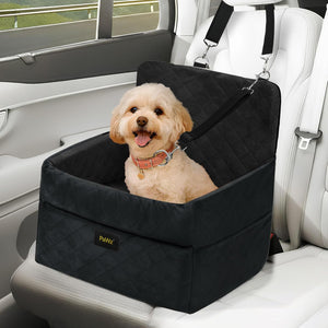 Dog sitting in a black pet seat in a car at Pet Servo