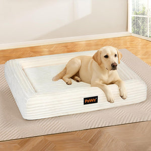 Dog lying on a large white pet bed with 'Pawz' branding in a room with wooden flooring at Pet Servo