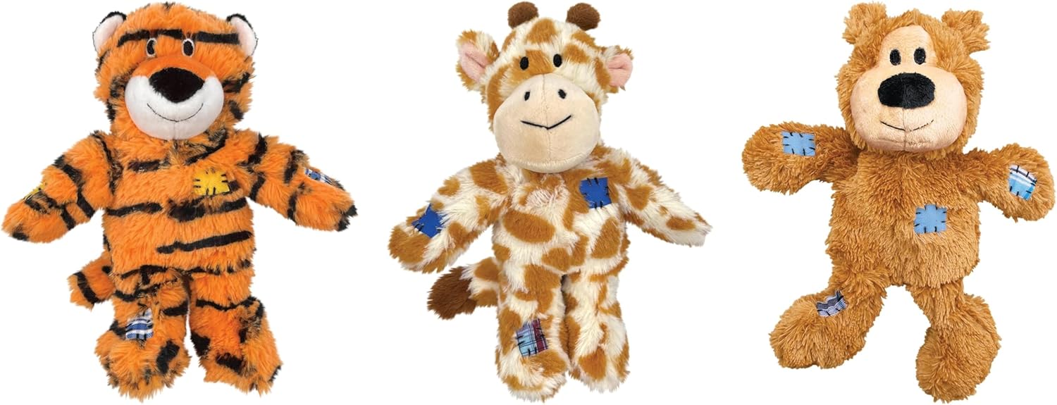 Three plush animal toys side by side: an orange tiger with black stripes, a tan and brown giraffe, and a light brown bear with blue paw patches at Pet Servo