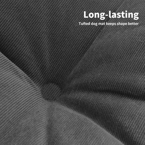 Close-up of a textured gray dog mat with text indicating its durability at Pet Servo