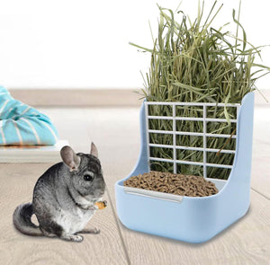 Pet feeder with hay and food for small animals on a light wooden floor at Pet Servo