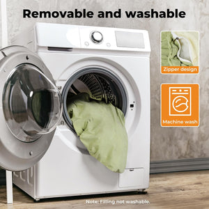 White washing machine with open door showing a green garment inside, on a wooden floor at Pet Servo