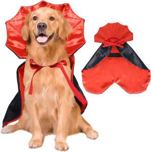 Dog wearing a red and black cape with a hood, sitting on a white background.