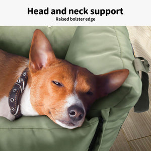 Dog resting its head on a green pet carrier with text 'Head and neck support Raised bolster edge' at Pet Servo