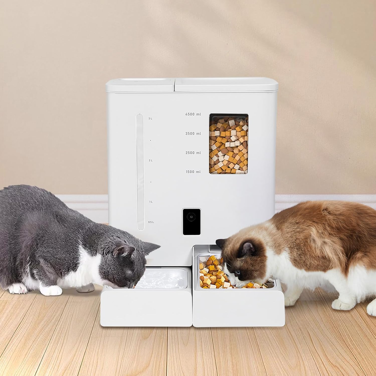 Two cats interacting with a white pet food dispenser on a wooden floor at Pet Servo